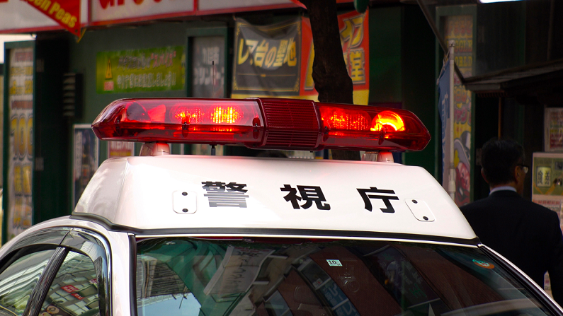 red lights on a Japanese police car