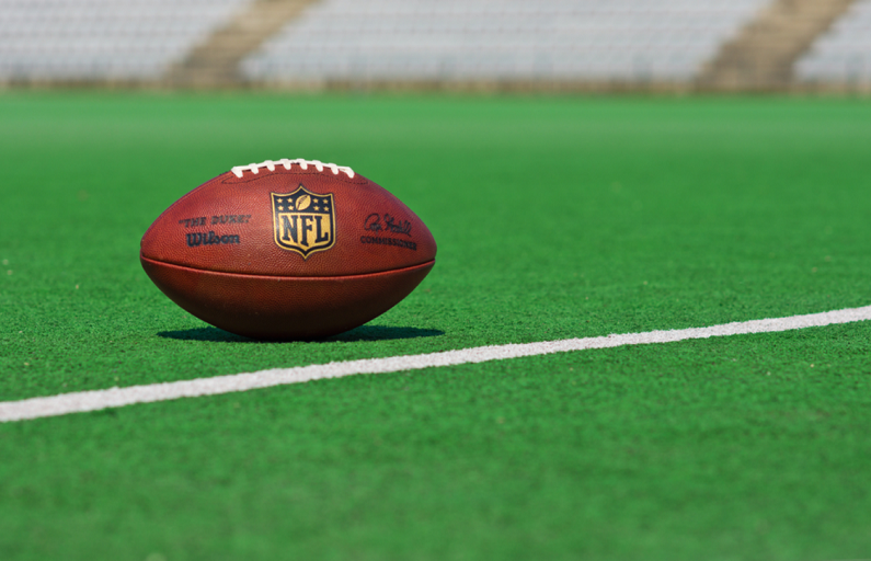 NFL-branded football on pitch