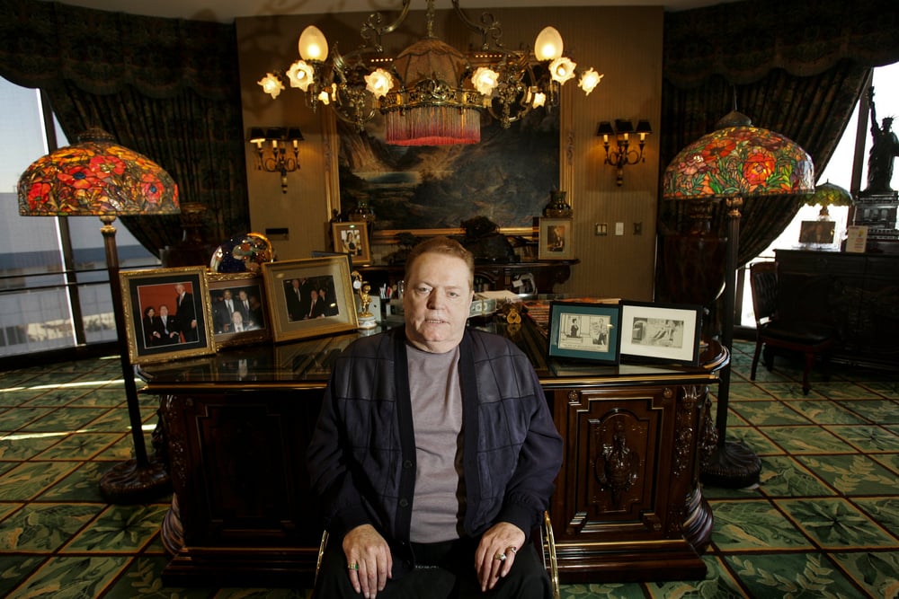 Larry Flynt sat in front of his desk